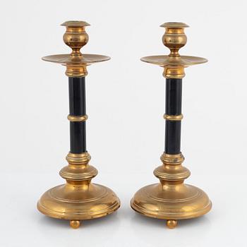 A pair of Skultuna brass and wood candlesticks, first part of the 20th century.