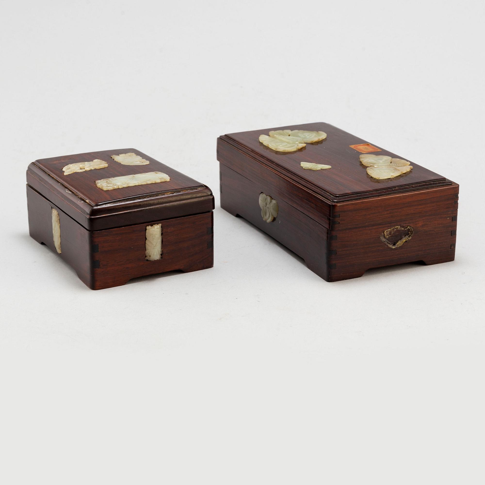 Two Chinese wooden boxes with covers, with nephrite objects, 20th century.