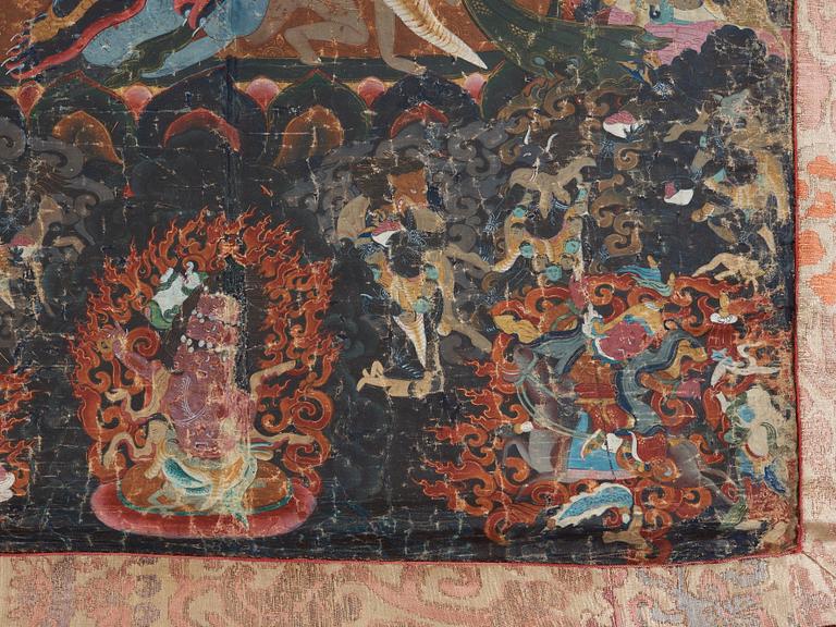 A Tibetan Thangka of Mahakala surrounded by fierce Dharma protectors, 19th century.