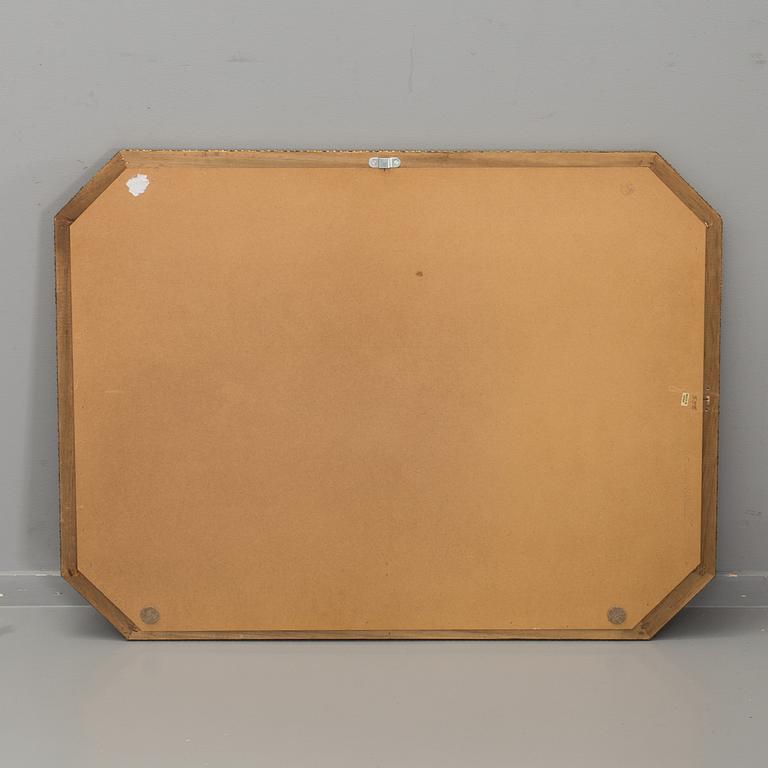 A WALL MIRROR MADE IN SPAIN.