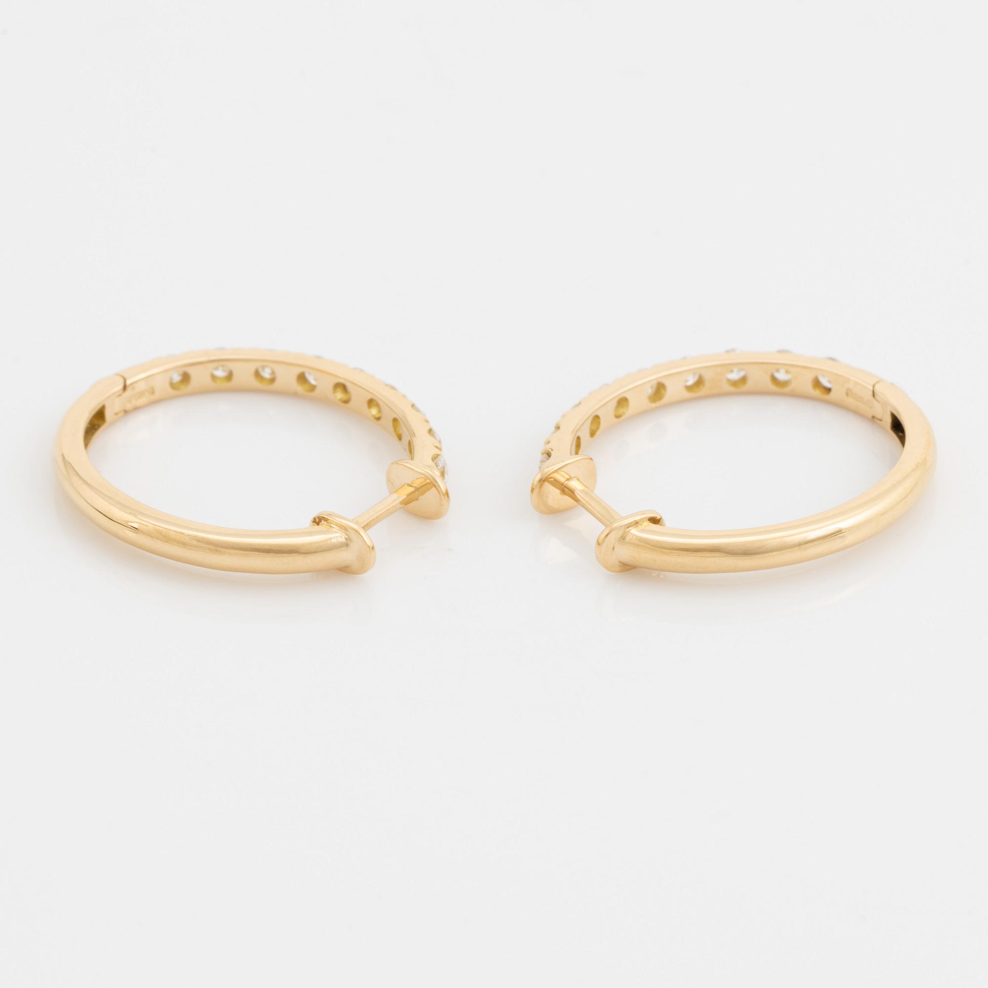 Brilliant cut diamond hoop earrings.