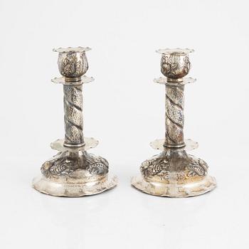 A pair of Baroque style silver candle sticks, Råströms Silver- O Nysilverfabrik, Stockholm, 1947.