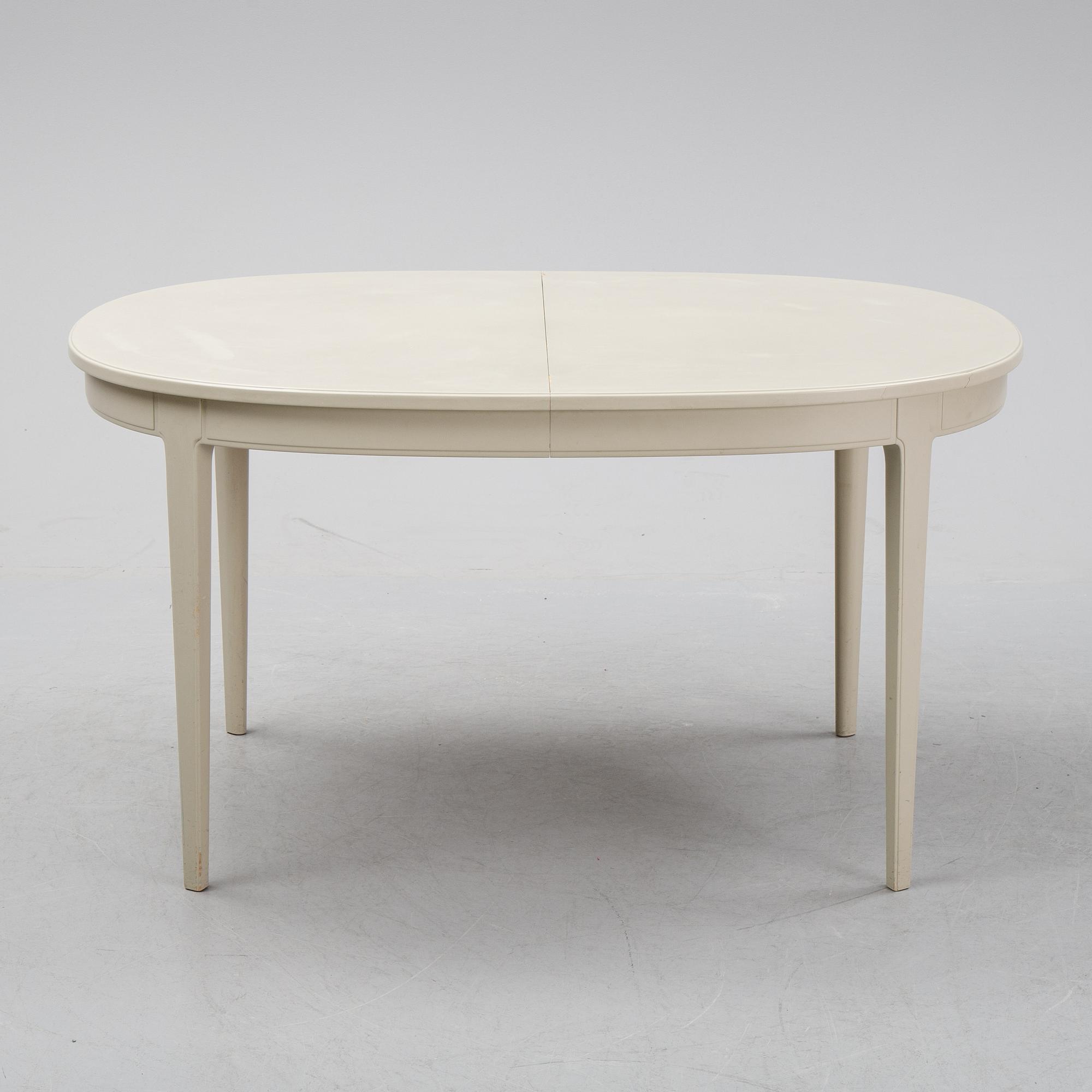 A dining table and six chairs by Carl Malmsten for Bodafors.