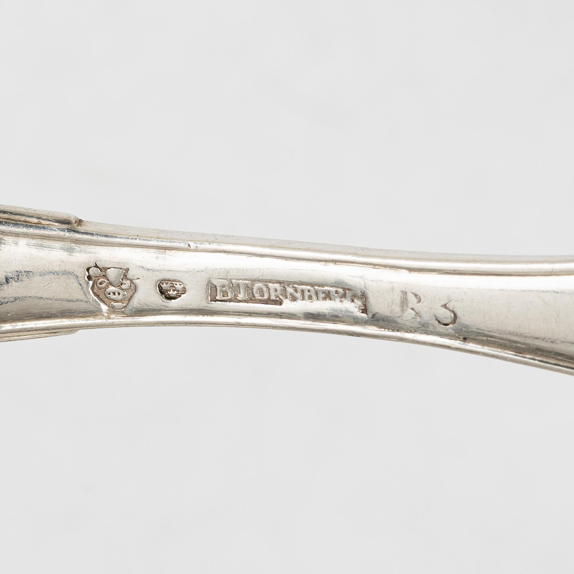 Bengt Törnberg, forks, 12 pcs, and Stephan Westerstråhle and Niklas Ramberg, spoons, a pair, early 19th century.