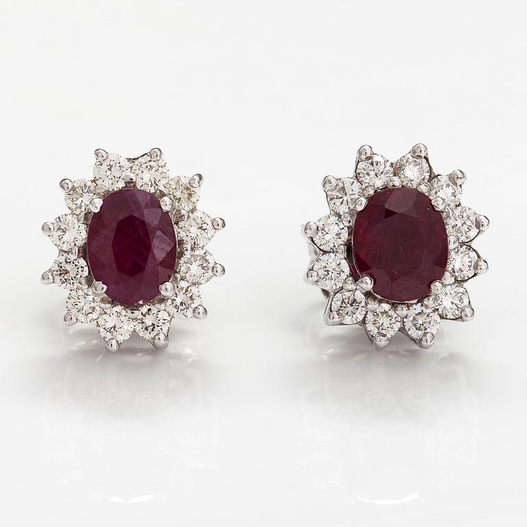 A pair of 18K white gold earrings with brilliant cut diamonds ca. 0.96 ct in total and rubies. Rubens, Helsinki.