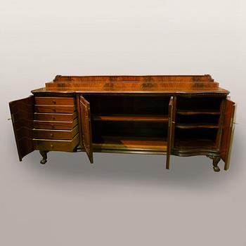 A 1920s Chippendale style buffet sideboard.