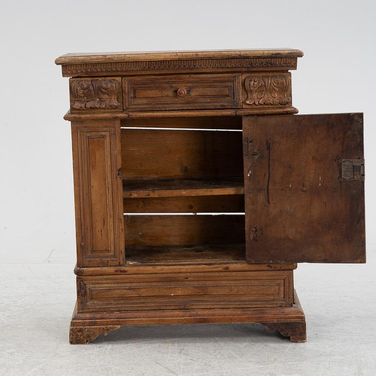 A Baroque style cabinet, circa 1900 with older parts.