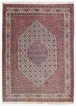 An oriental rug, approx. 238 x 174 cm.