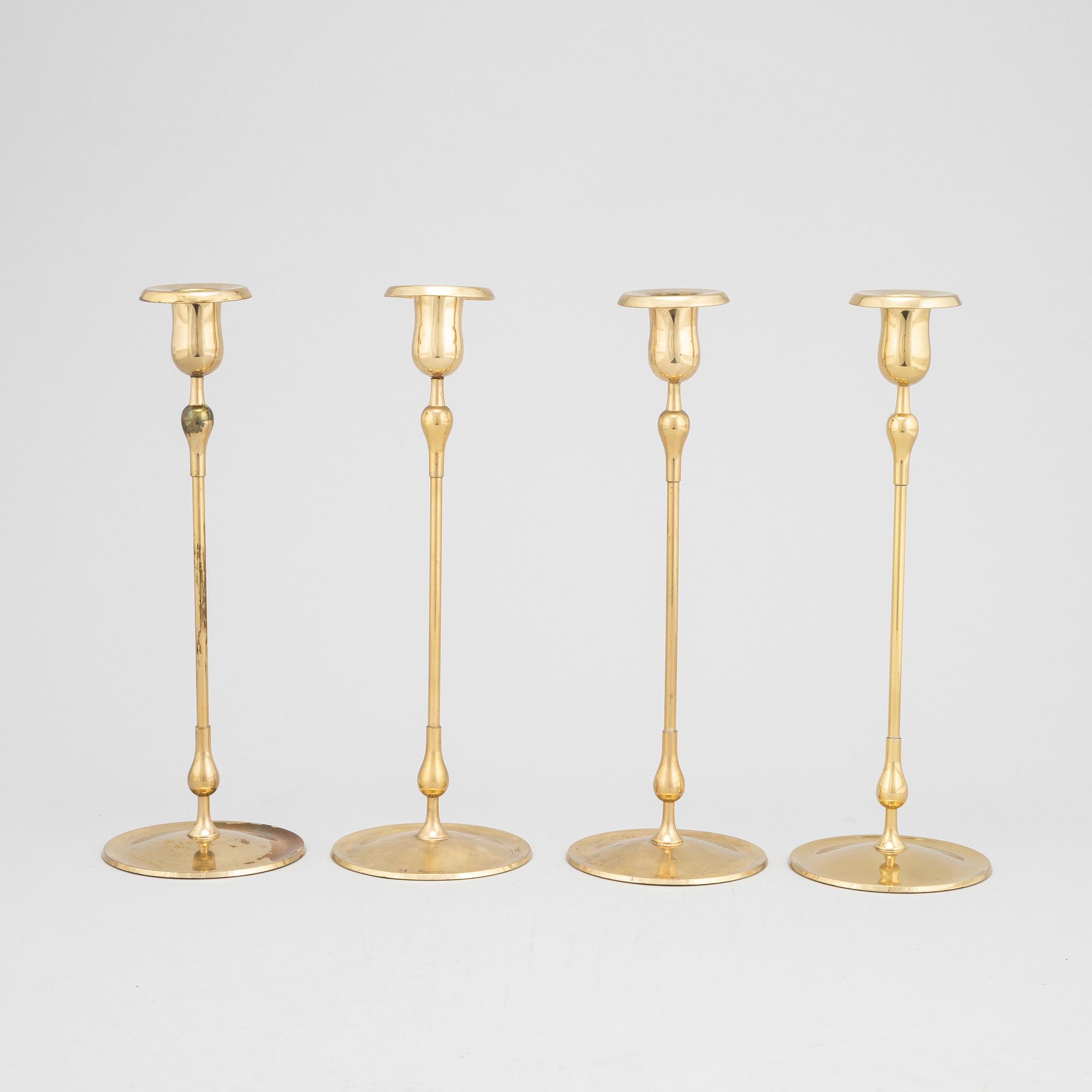 Gunnar Ander, a set of four brass candlesticks from Ystad Metall.
