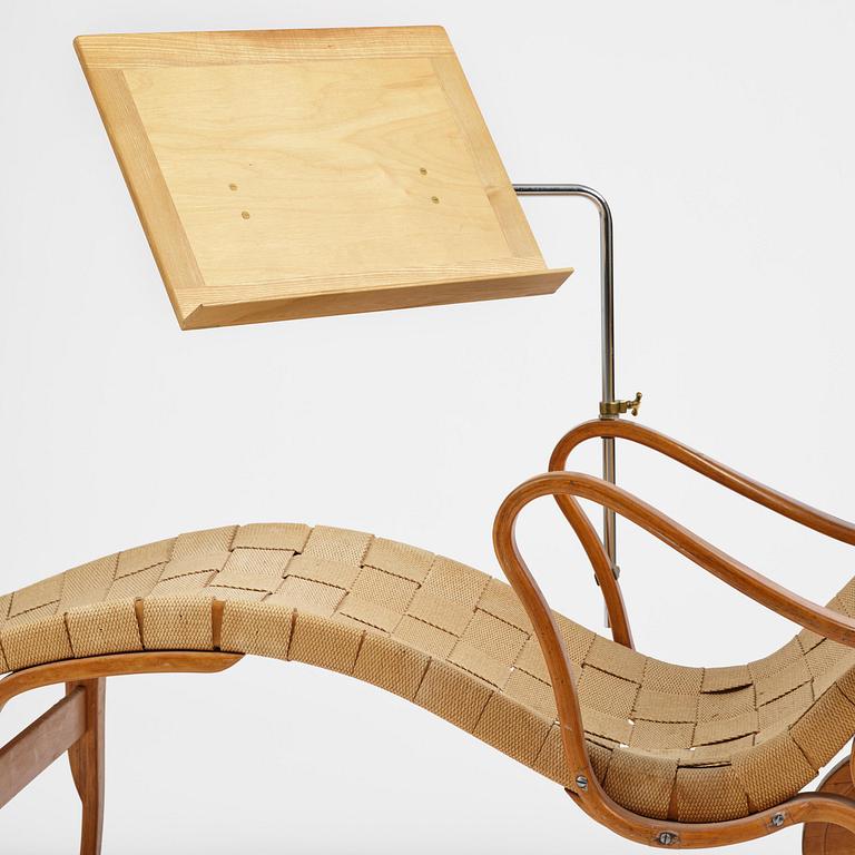 Bruno Mathsson, a lounge chair with wheels, Firma Karl Mathsson, Värnamo, 1940s, with reading table from 1972.