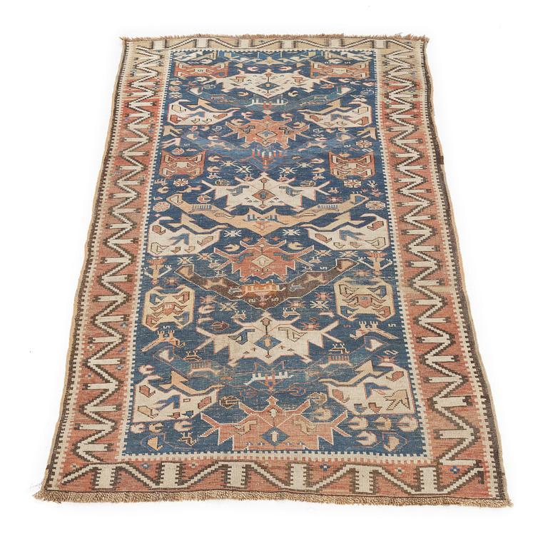 An oriental rug, c. 200 x 115 cm.