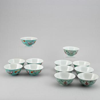 A set of 12 famille rose bowls against a turkoise ground, China, 20th Century.