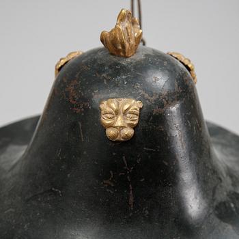 A Swedish Empire style 20th century three-light patinated brass hanging-lamp.