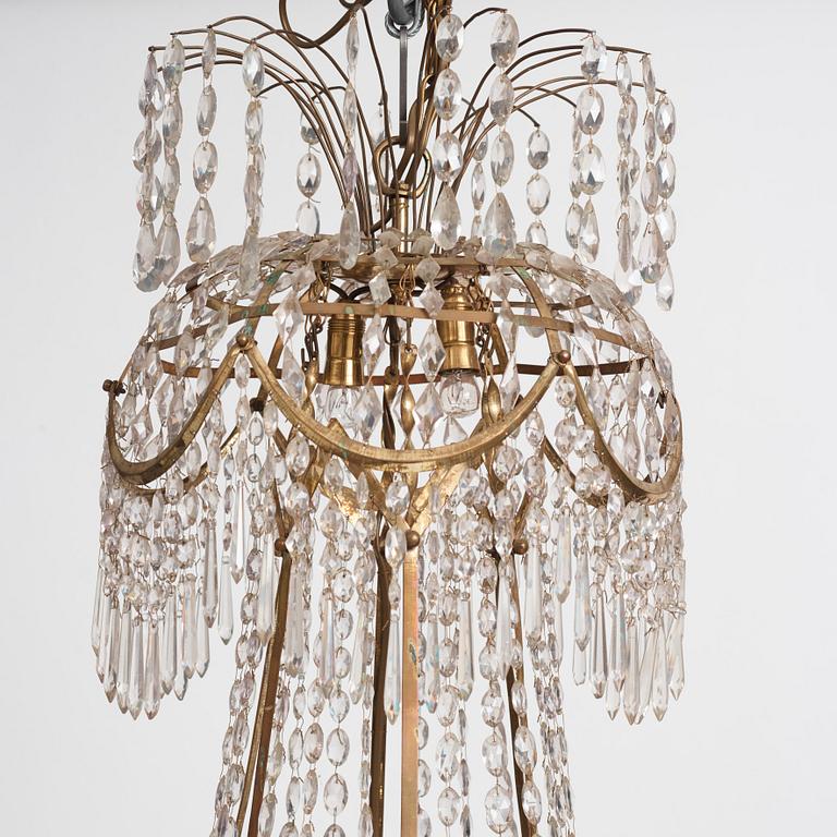 A late Gustavian gilt brass and cut glass seven-light chandelier, Stockholm, late 18th century.