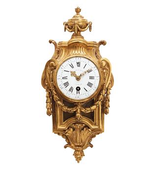 1658. A Louis XVI 1770's gilt bronze wall clock.