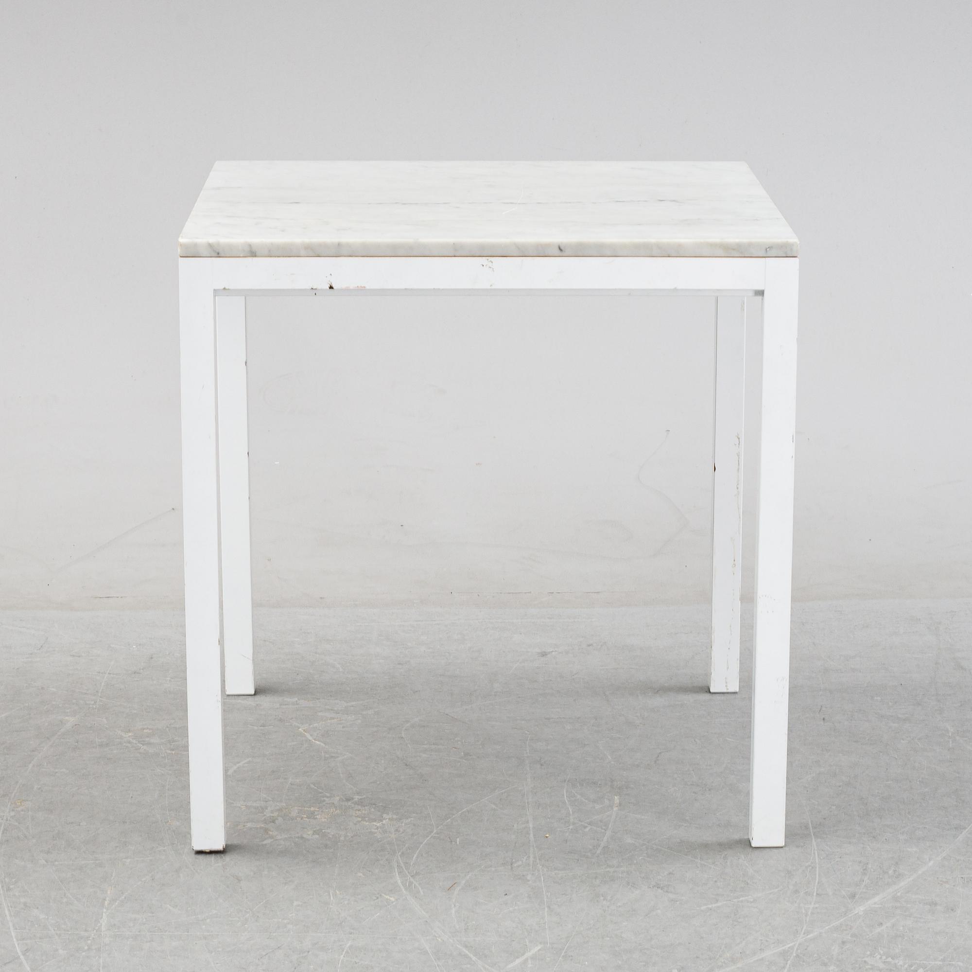 A marble top table, 21th century.