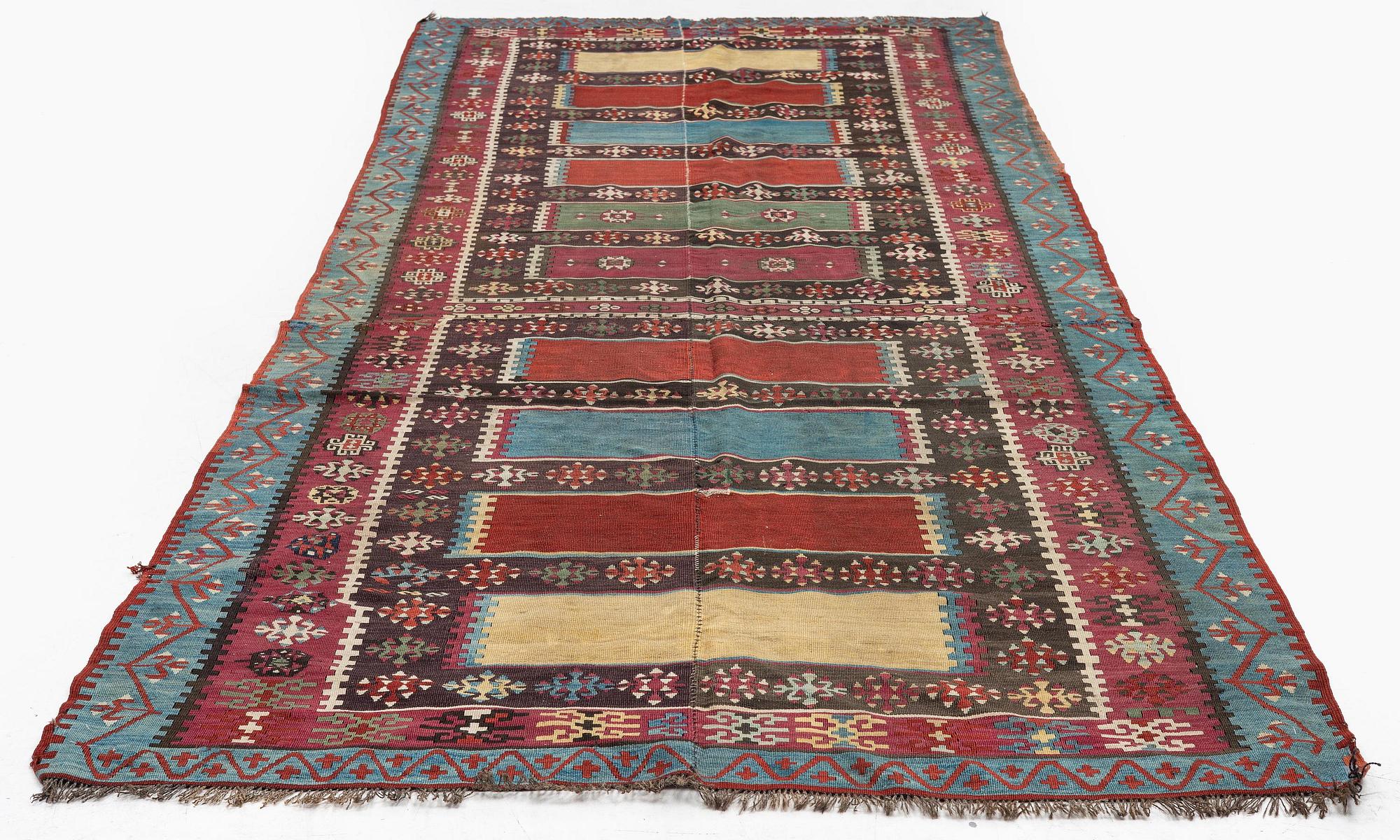 An antique Anatolian kilim, c. 374 x 148 cm.