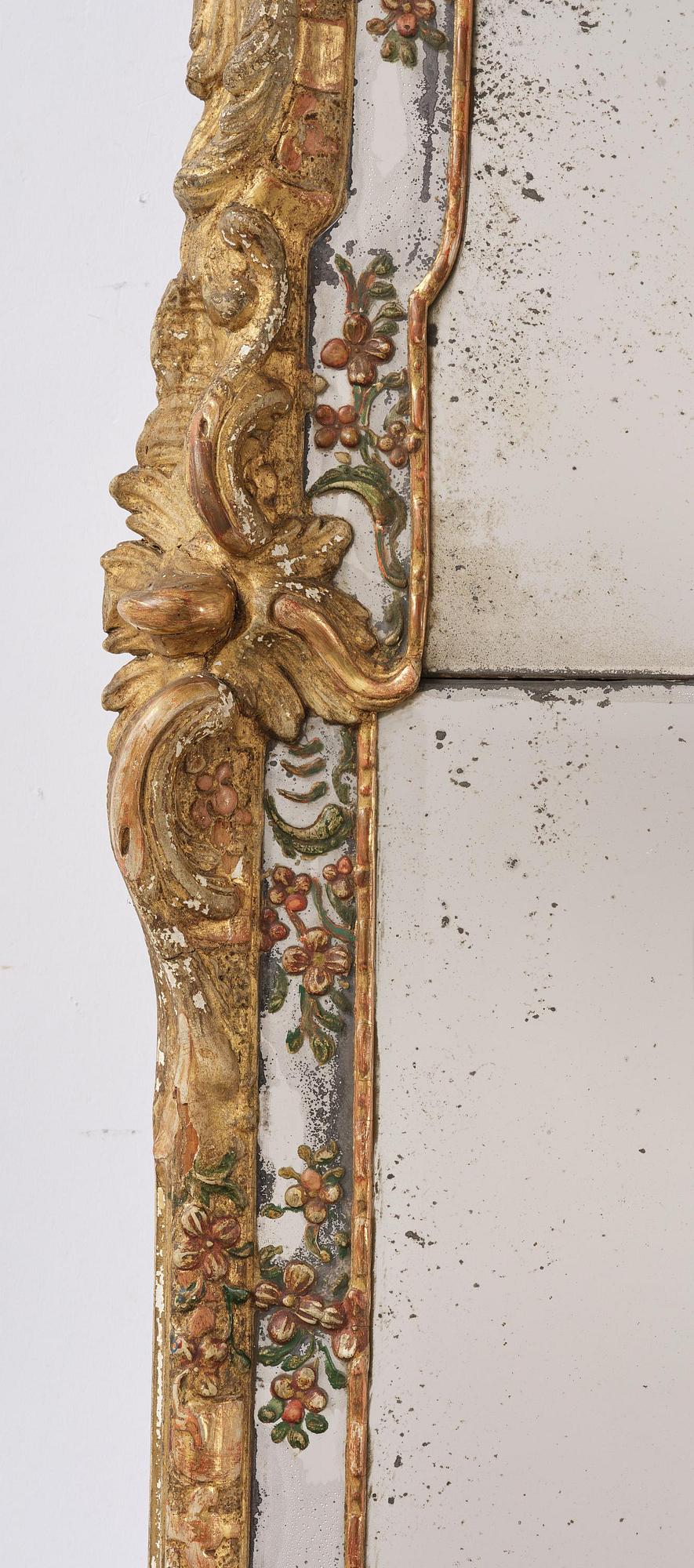 A Swedish giltwood and polychrome-painted Rococo mirror, later part of the 18th century.