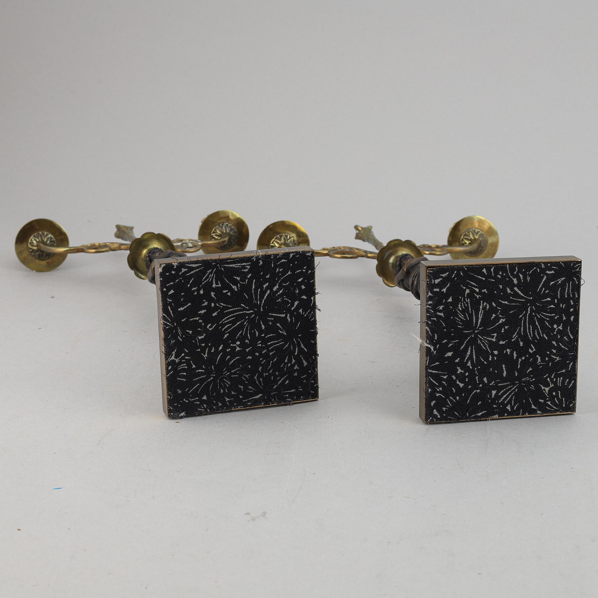 A pair of brass Empire style candle holders, 20th century.