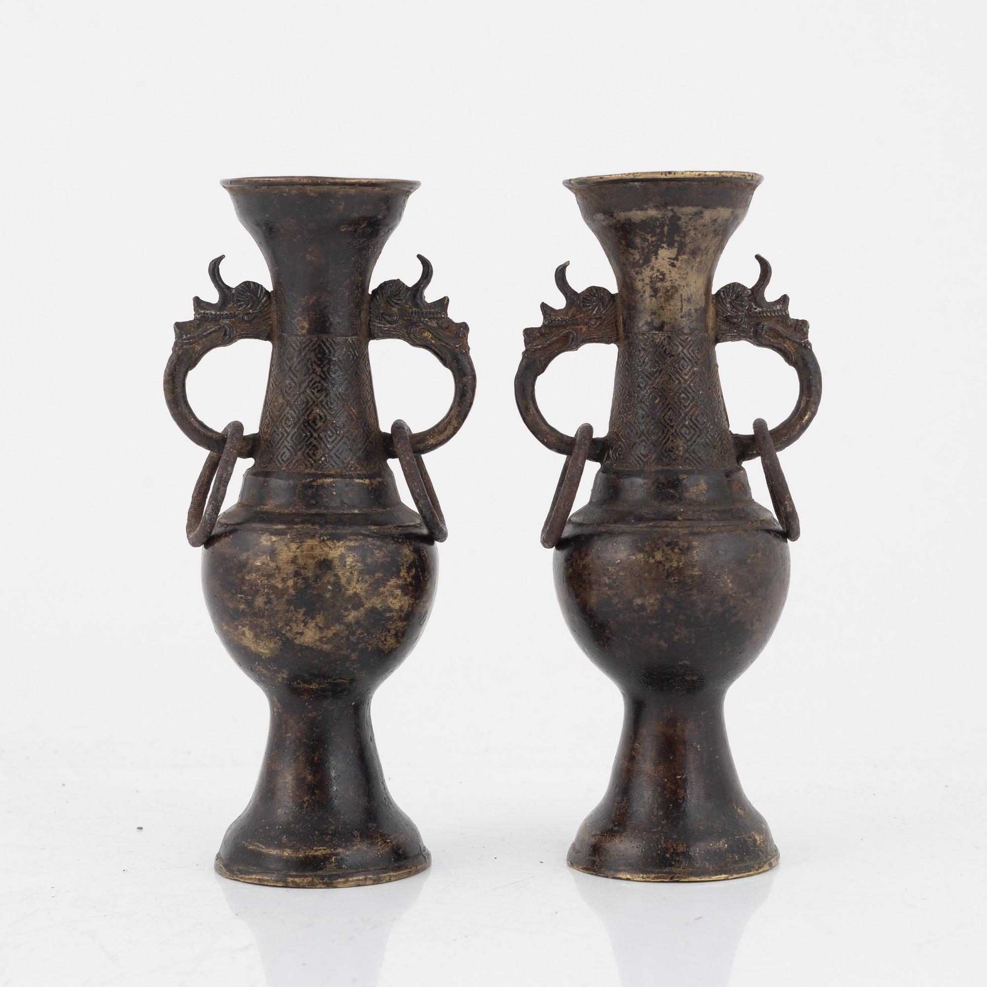 A pair of Chinese bronze altar vases, Ming dynasty (1368-1644).