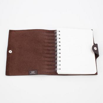 HERMÈS, a brown leather notebook, "Ulysse Petit Modèle".