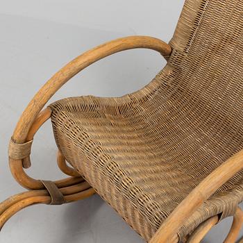 a rattan and bamboo rocking chair from the second half of the 20th century.