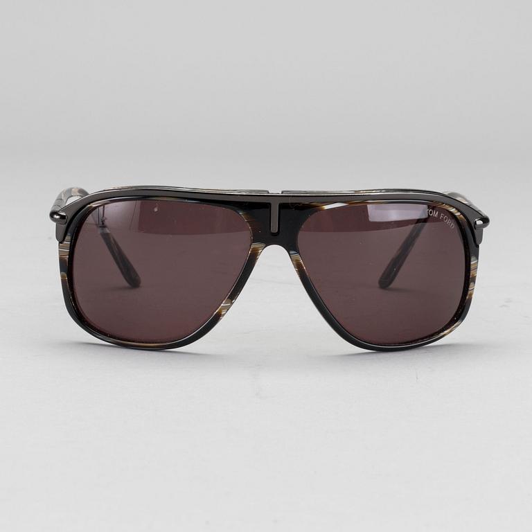 Two pair of Tom Ford Sunglasses.