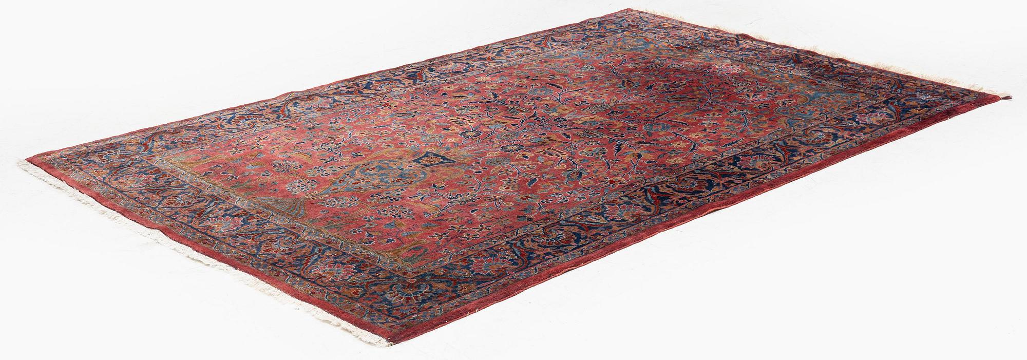 An antique Manchester Kashan rug, c. 197 x 126 cm.