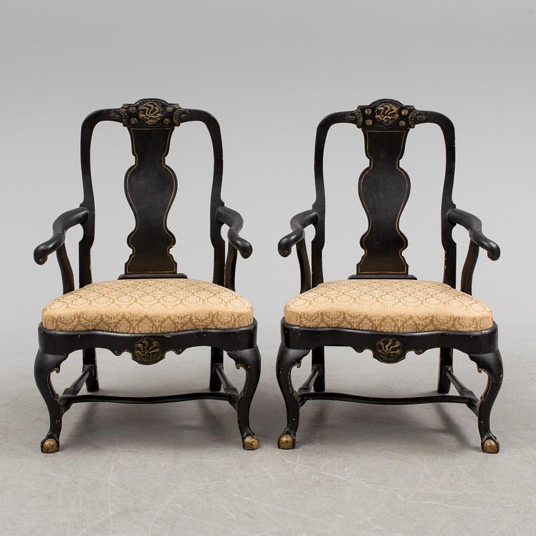 A pair of 18th century armchairs.