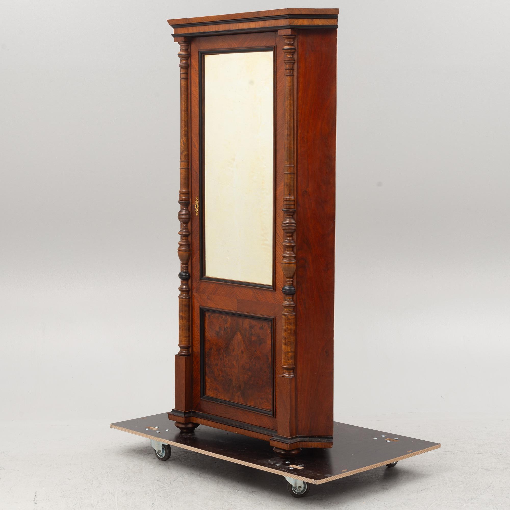 A corner cabinet, circa 1900.
