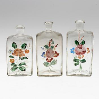 THREE 19TH CENTURY GLASS SPIRIT DECANTERS.