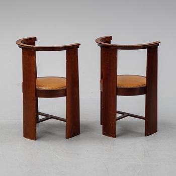 Eliel Saarinen, a pair of 'Hannes'' mahogany armchairs, Adelta Oy, Finland, 1983.