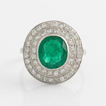 Ring, platinum with emerald and octagonal cut diamonds.