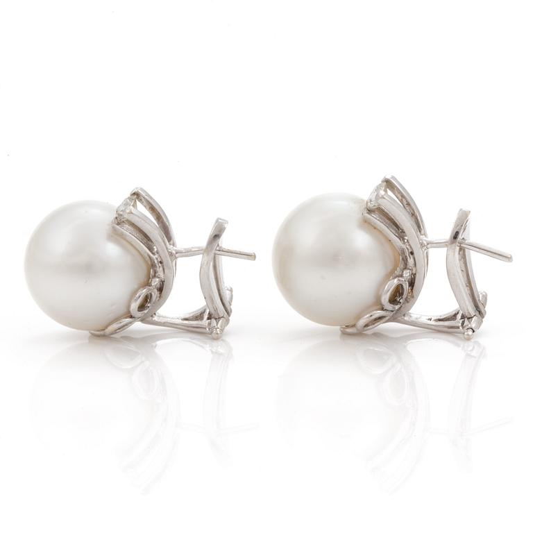 A pair of cultured South Sea pearl  and diamond earrings.