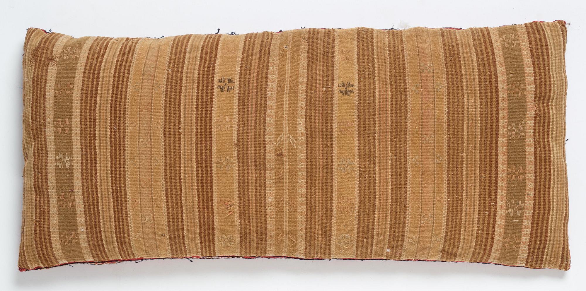 A CARRIAGE CUSHION, "Urnor och blommor", embroidered, ca 48 x 107 cm, Scania, Sweden 1830.
Filled.