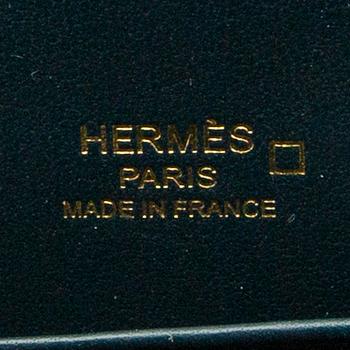 Hermès, bag "Green Shiny Alligator Mini Roulis 18 Permabrass Hardware" 2021.