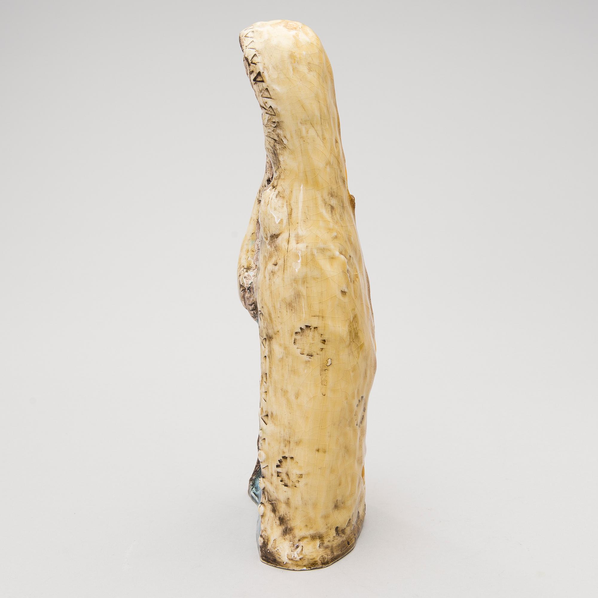 A stoneware figurine signed BRYK.