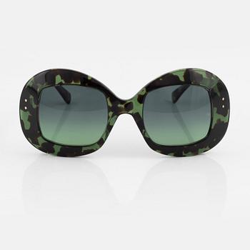 Oliver Goldsmith, a pair of green "Uuksu" sunglasses.