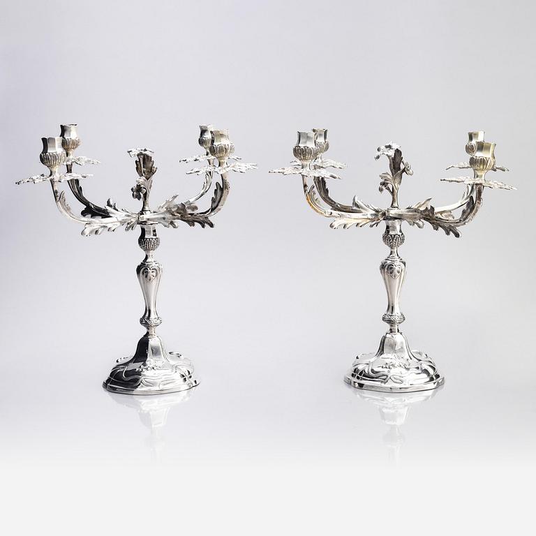 A pair of German 18th century silver candelabras, mark of C.C. Papcke, Stralsund.