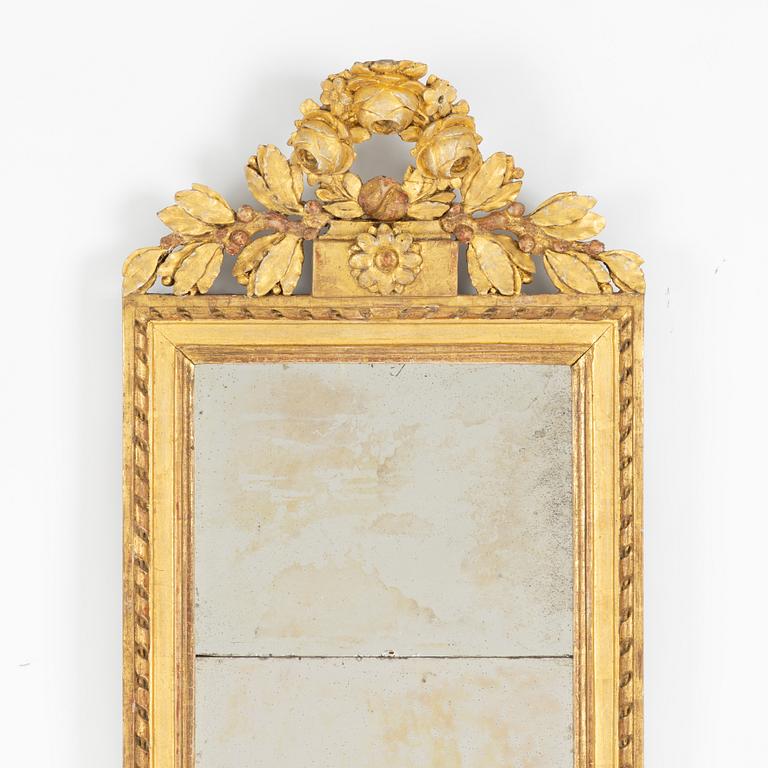 A Gustavian giltwood mirror, Stockholm, late 18th century.