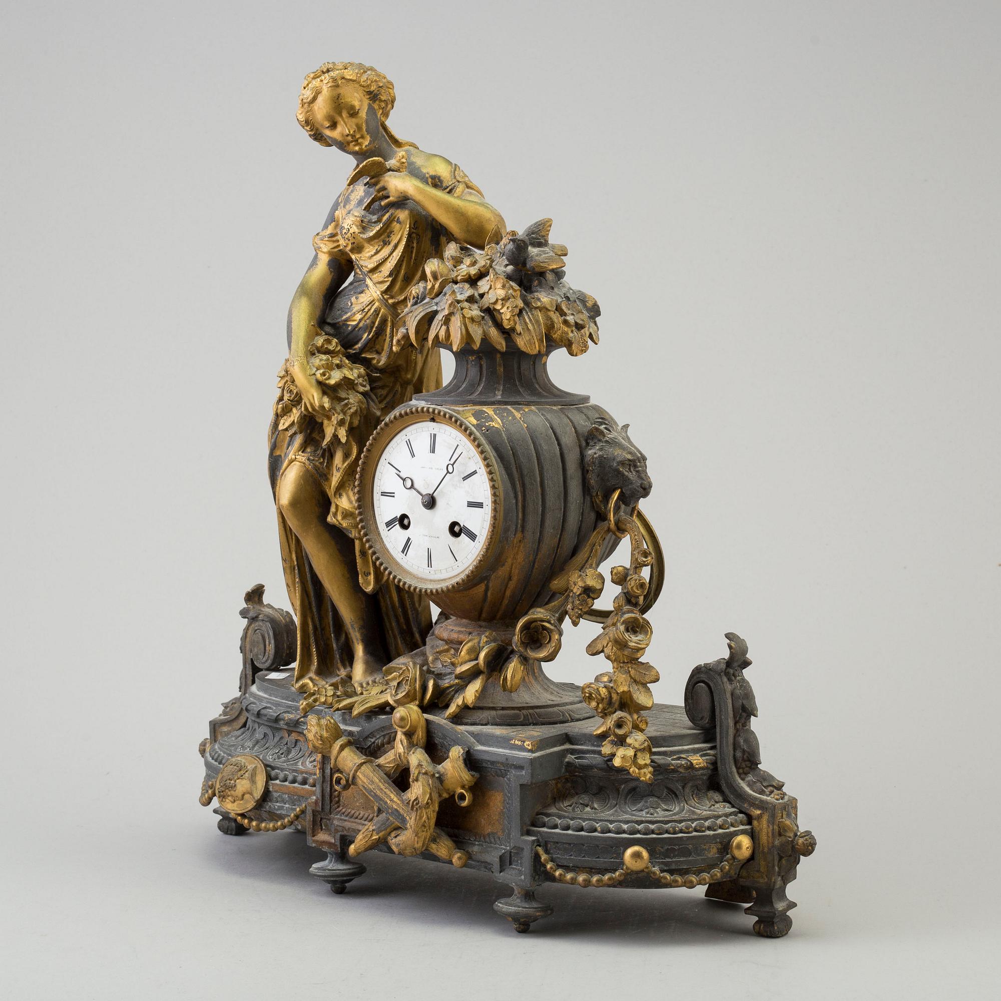 An end of the 20th century metal case mantle clock.