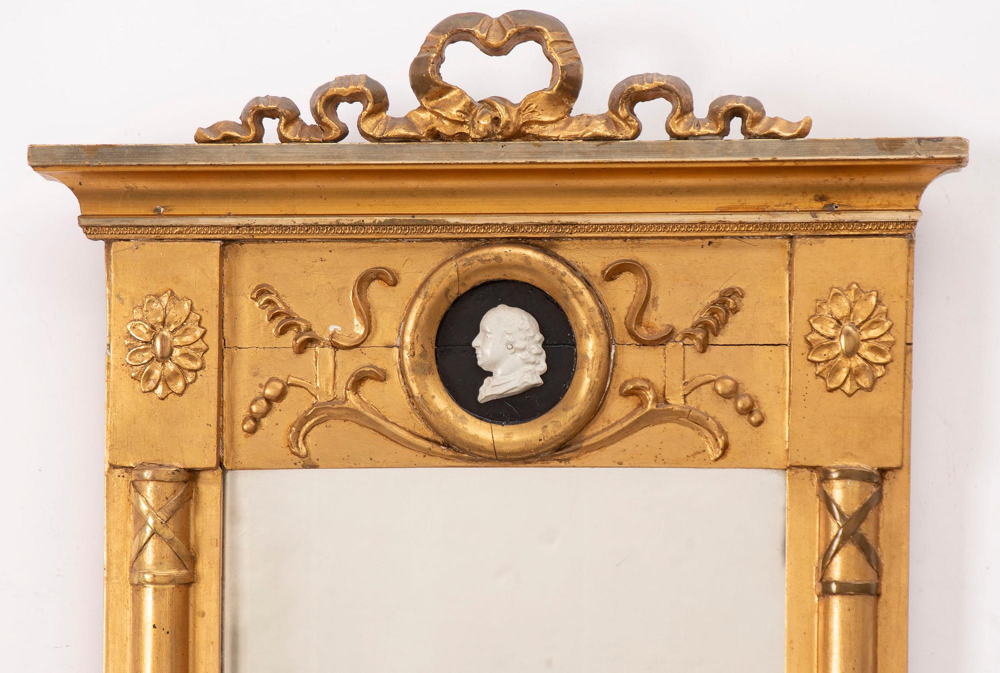 A Gustavian style mirror, early 20th Century.