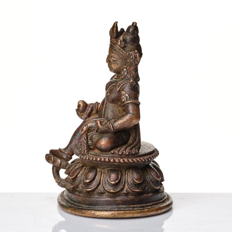 A copper alloy figure of Jambhala, Nepal, possibly 12/13th Century.