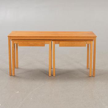 A 1960s oak nesting table.