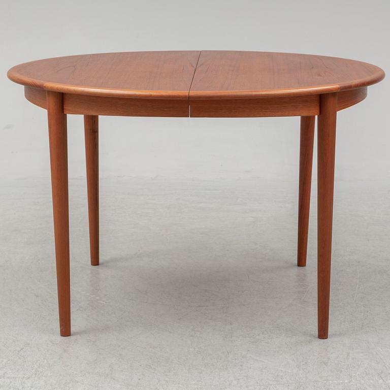 A 1960s teak veneered dining table.