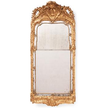 91. A Swedish rococo carved giltwood and gesso mirror, later part of the 18th century.