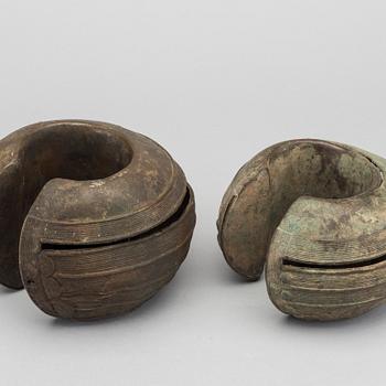 Two bronze currency braclets, Baule, Ivory Coast.