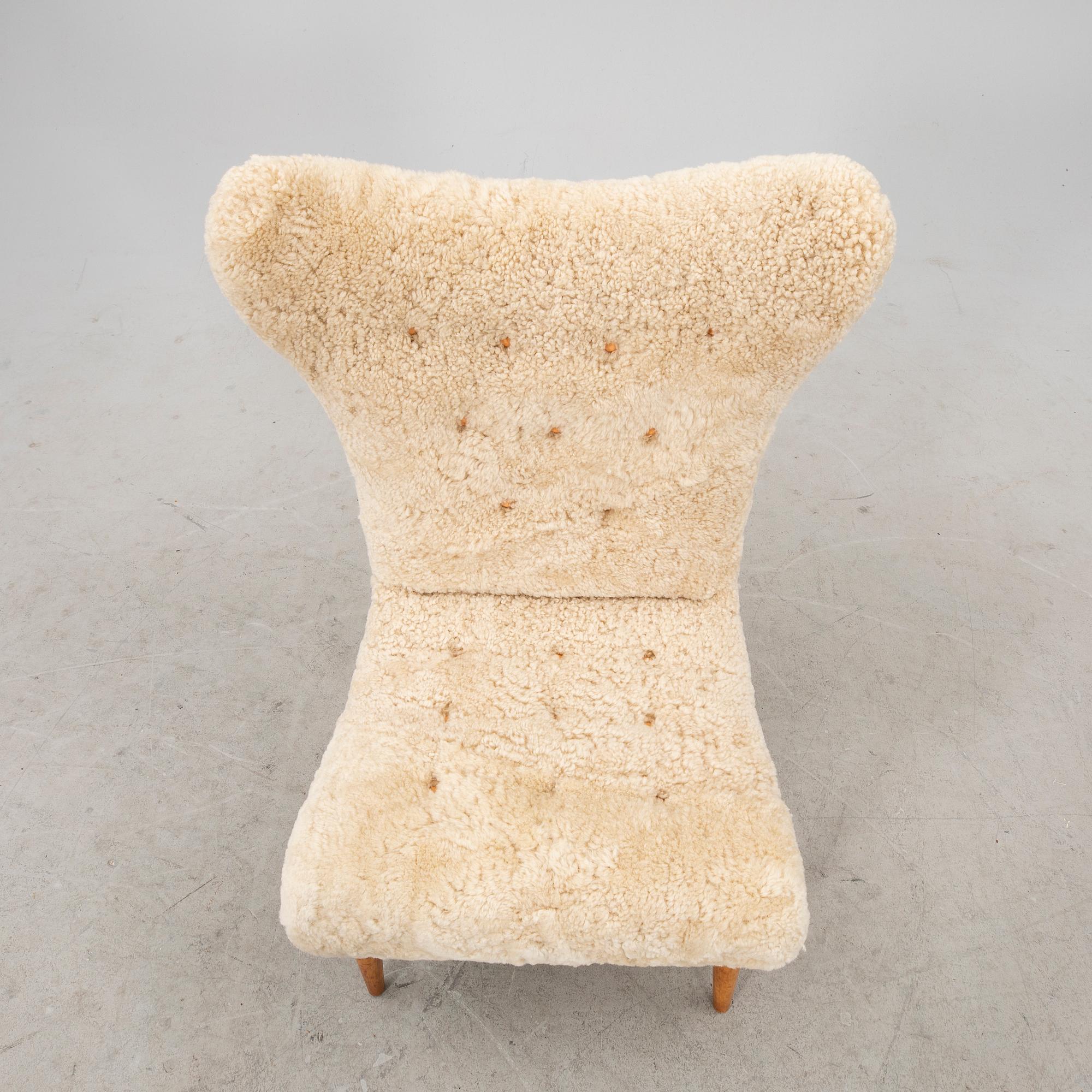A Swedish Modern 1940s sheep skin armchair.