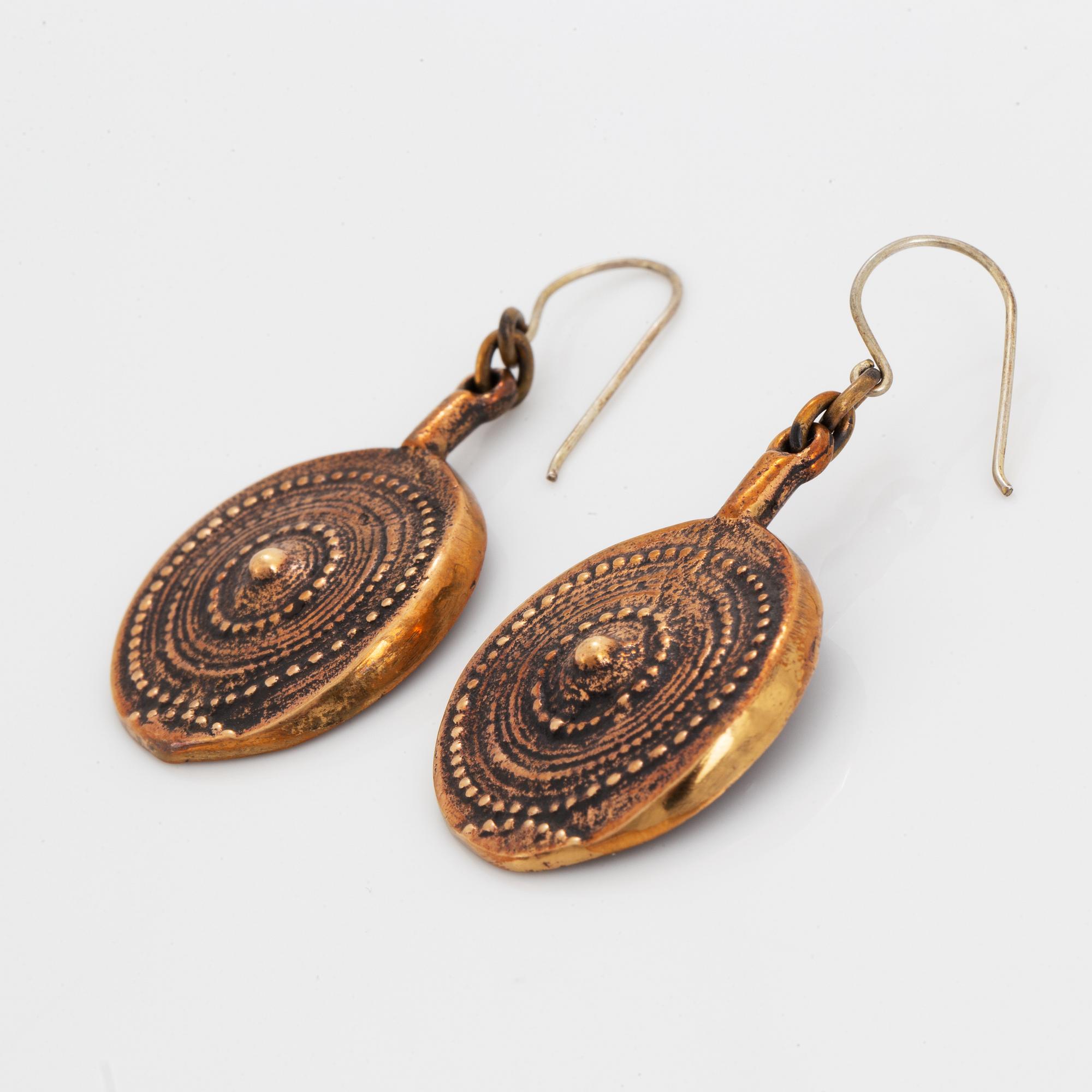 A pair of Jorma Laine earrings in bronze.