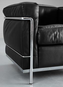 A pair of Le Corbusier 'LC 2' black leather and chromed steel easy chairs, Cassina, Italy.